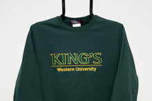 Load image into Gallery viewer, King&#39;s College Crewneck Sweatshirt, Green  Get comfortable in our unisex crewneck sweatshirt.  Sporty twill appliqué and embroidery logo makes a bold and distinctive statement. Easy care, pre-shrunk, 50% cotton, 50% polyester and machine washable.  Forest green with gold accents.
